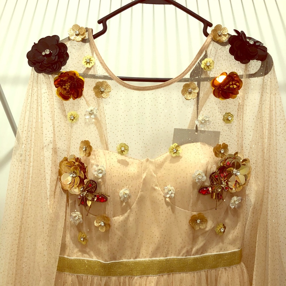 Formal dress with sheer sleeves and sequin detail